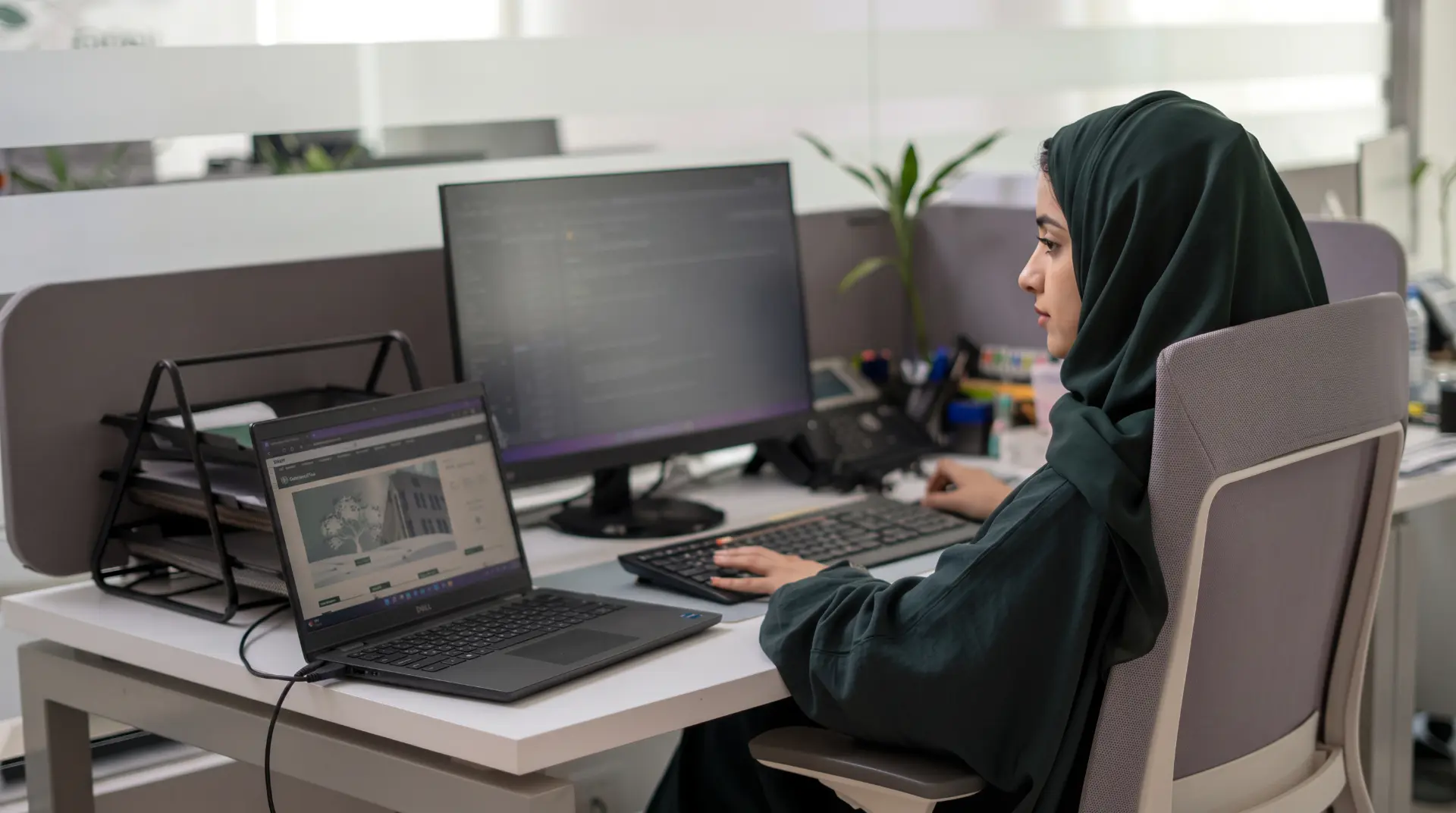 AZAQ employee working at her desk
